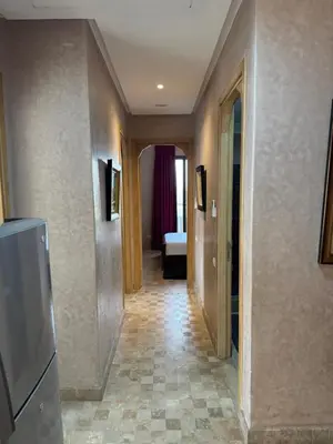 a hallway leading to a room with a bed at Appart 2ch Marrakech in Sraghna