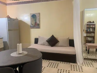 a living room with a couch and a table at The Red Flat in Marrakech