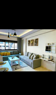 a living room with a couch and a table at Stylish Appartement in Marrakech in Marrakech