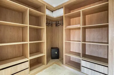 a walk in closet with wooden shelves at Villa Gina, chic et Moderne avec piscine&terrasse in Marrakech
