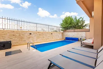 a swimming pool in the backyard of a house at Villa Gina, chic et Moderne avec piscine&terrasse in Marrakech