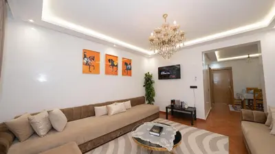 a living room with a couch and a table at Appartement à Marrakech in Marrakech