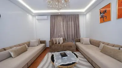 a living room with a couch and a table at Appartement à Marrakech in Marrakech