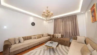 a living room with a couch and a table at Appartement à Marrakech in Marrakech