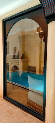 a view of a room through a glass window at Riad Sarasvati & SPA in Marrakech
