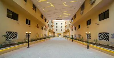 an empty hallway of a building with lights on it at Burj Malak appartement dans une résidence privée avec piscine in Marrakech