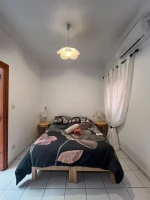 a bedroom with a large bed in a room at Riad Kinane Romann in Marrakech