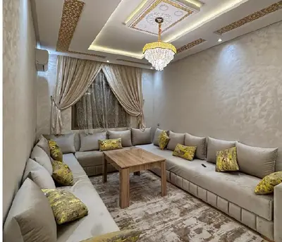 a living room with a couch and a table at Retraite paisible à Gueliz in Marrakech