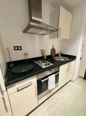 a kitchen with two sinks and a counter top at Luxueux 1 Chambre Guéliz Centre in Marrakech