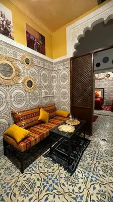 a living room with a couch and a table at Central Marrakesh Medina Apartment in Marrakech