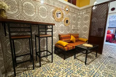 a living room with a couch and a bunk bed at Central Marrakesh Medina Apartment in Marrakech