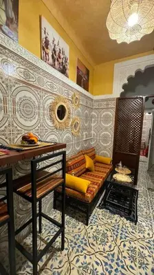 a living room with a couch and a table at Central Marrakesh Medina Apartment in Marrakech