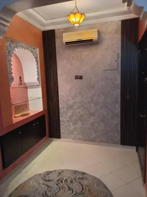 a walk in shower in a room with a window at Superbe Appartement 2 chambres à AL FADL Marrakech in Marrakech