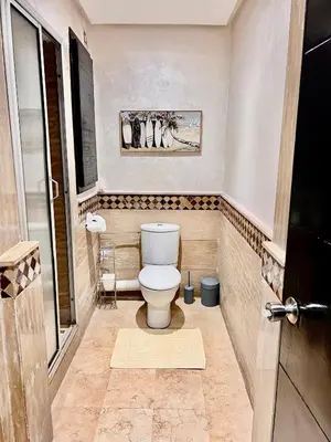 a bathroom with a toilet in a room at Résidence Miramas 2 E1 in Marrakech