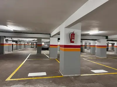 an empty parking lot with a car parked in it at Résidence Miramas 2 E1 in Marrakech