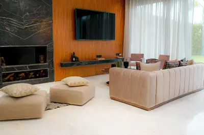a living room with a couch and a fireplace at Villa de luxe Avec piscine à Argan Golf Resort in Marrakech