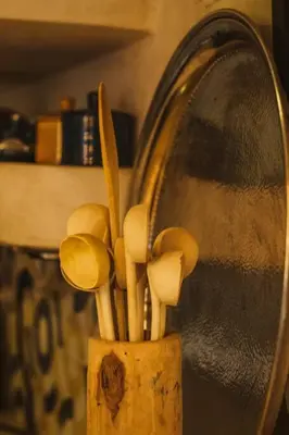 a wooden container filled with mushrooms next to a sink at RIAD Dar Argana 100m Place Jemaa el- Fna heated Pool in Marrakech