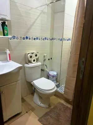 a small bathroom with a toilet and a shower at Dar yahya in Marrakech
