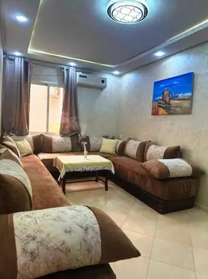 a large living room with couches and a table at Dar yahya in Marrakech