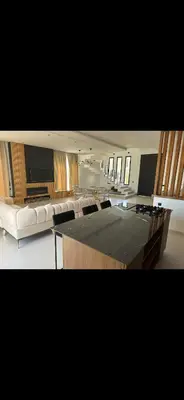 a living room with a couch and a table at Luxe villa in marrakech in El Makina