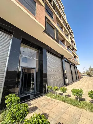 a store front of a building with its door open at Appartement neuf 1 Ch - 5 min de la gare in Marrakech
