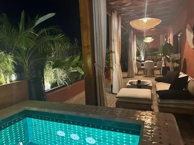 a swimming pool in a house with a living room at Roof top terrasse Centre-Gueliz JACUZZI in Marrakech