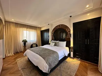 a bedroom with a large bed in a room at Roof top terrasse Centre-Gueliz JACUZZI in Marrakech