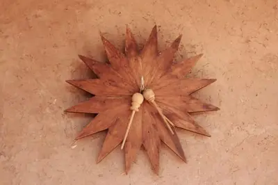 a wooden star shaped object on the floor at DAR SMAWAR top piscine chauffée 15mn centre ville in El Caïd Omar
