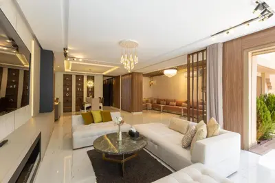 a living room with a white couch and a table at Villa Golf Marrakech in Marrakech