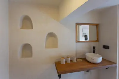 a bathroom with a sink and a mirror at Riad Tawja in Marrakech