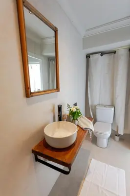 a bathroom with a sink and a toilet and a mirror at Riad Tawja in Marrakech
