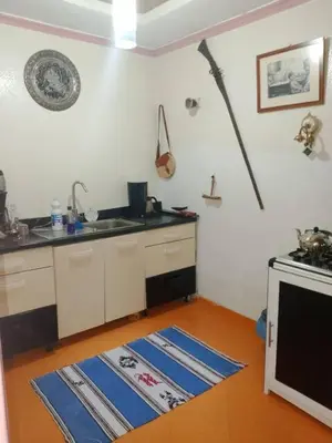 a kitchen with a sink and a stove at Dar Diego des appartements au Centre de la Médina in Marrakech