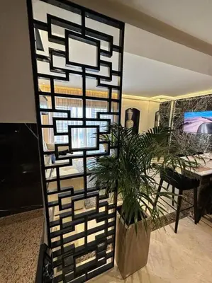 a plant in a vase in a living room at Ultra-Luxury 2-Bedroom Apartment in City Center Atlas View in Marrakech