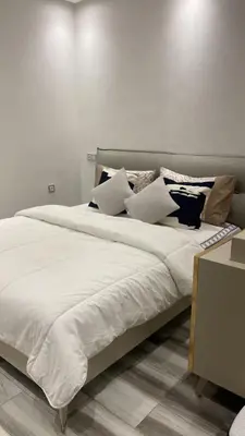 a large bed with white sheets and pillows on it at Appart à Marrakech,spacieux, calme et propre in Marrakech