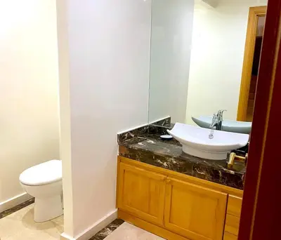 a bathroom with a sink and a toilet at Yasmine Majorelle Marrakech in Marrakech
