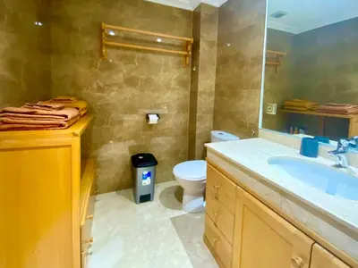a bathroom with a sink and a toilet at Yasmine Majorelle Marrakech in Marrakech