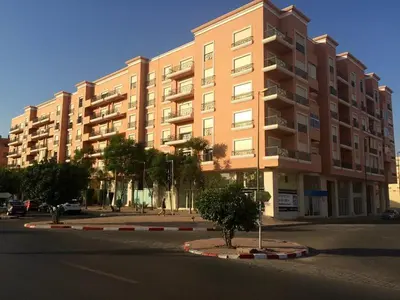 a large apartment building on a city street at Yasmine Majorelle Marrakech in Marrakech