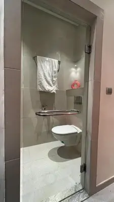 a bathroom with a toilet and a towel at Ourika immoblier in Marrakech