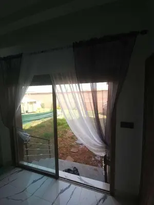 a room with a window with a view of a yard at Apparemment chic in Marrakech