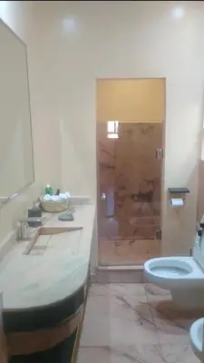 a bathroom with a toilet and a sink and a shower at Ykar in Marrakech