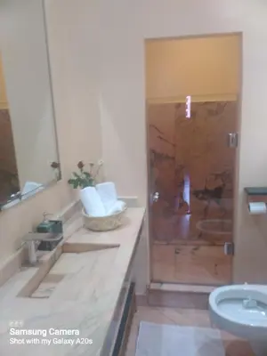 a bathroom with a shower and a sink at Ykar in Marrakech