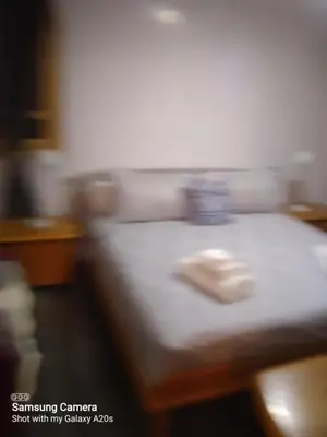 a blurry picture of a bed with a mouse on it at Ykar in Marrakech