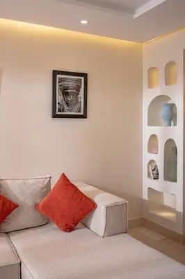a living room with a couch with red pillows at Magnifique appart Moderne à Gueliz in Marrakech