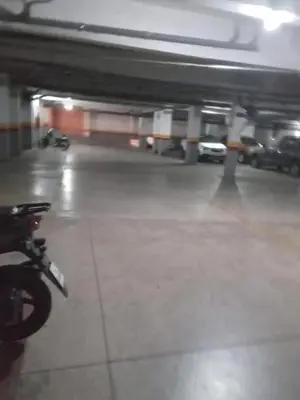 a parking garage with a motorcycle parked in it at دوبلكس في مراكش in Marrakech