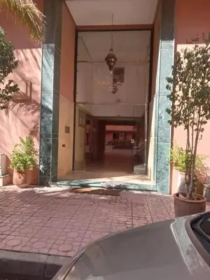 a building with a large mirror on the side of it at دوبلكس في مراكش in Marrakech