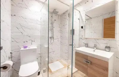 a bathroom with a toilet and a sink and a shower at Appartement gueliz in Marrakech