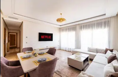 a living room with a couch and a table at Appartement gueliz in Marrakech