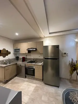 a kitchen with a stainless steel refrigerator at Yany cosy appartement in Marrakech