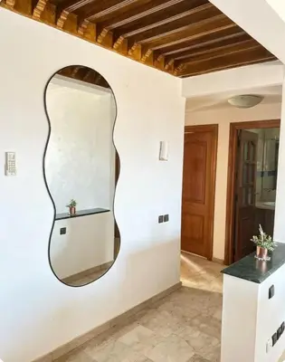 a mirror on the wall of a room at New nice apartment city center swimming pool wifi in Marrakech