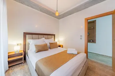 a bedroom with a large bed and a window at Luxueux appartement -70 haut gamme Guéliz in Marrakech